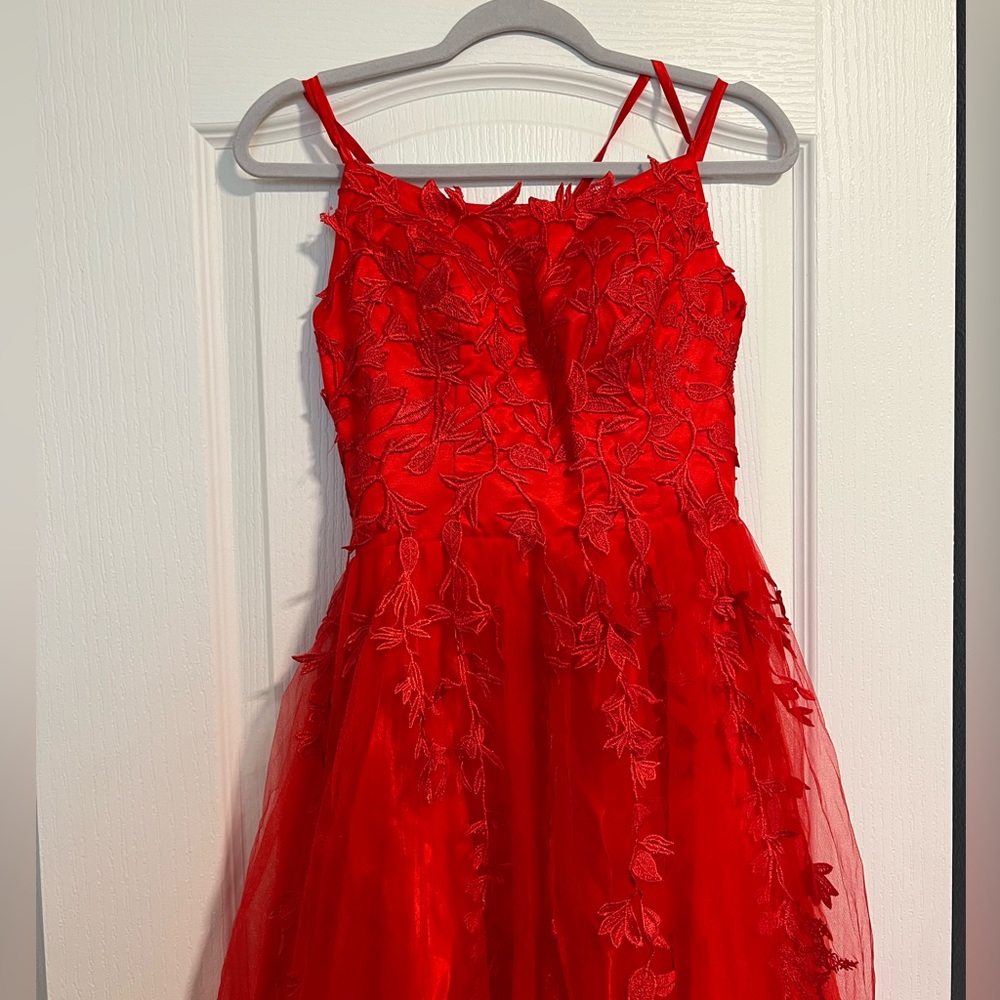 Red prom dress, never worn and new with tags attatched! Size 2 long